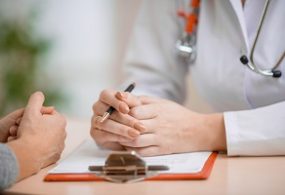 Doctor consulting patient in her office